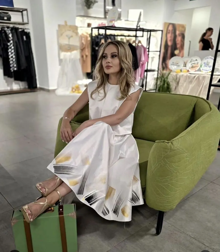 White dress with hand-painted print, in boutique